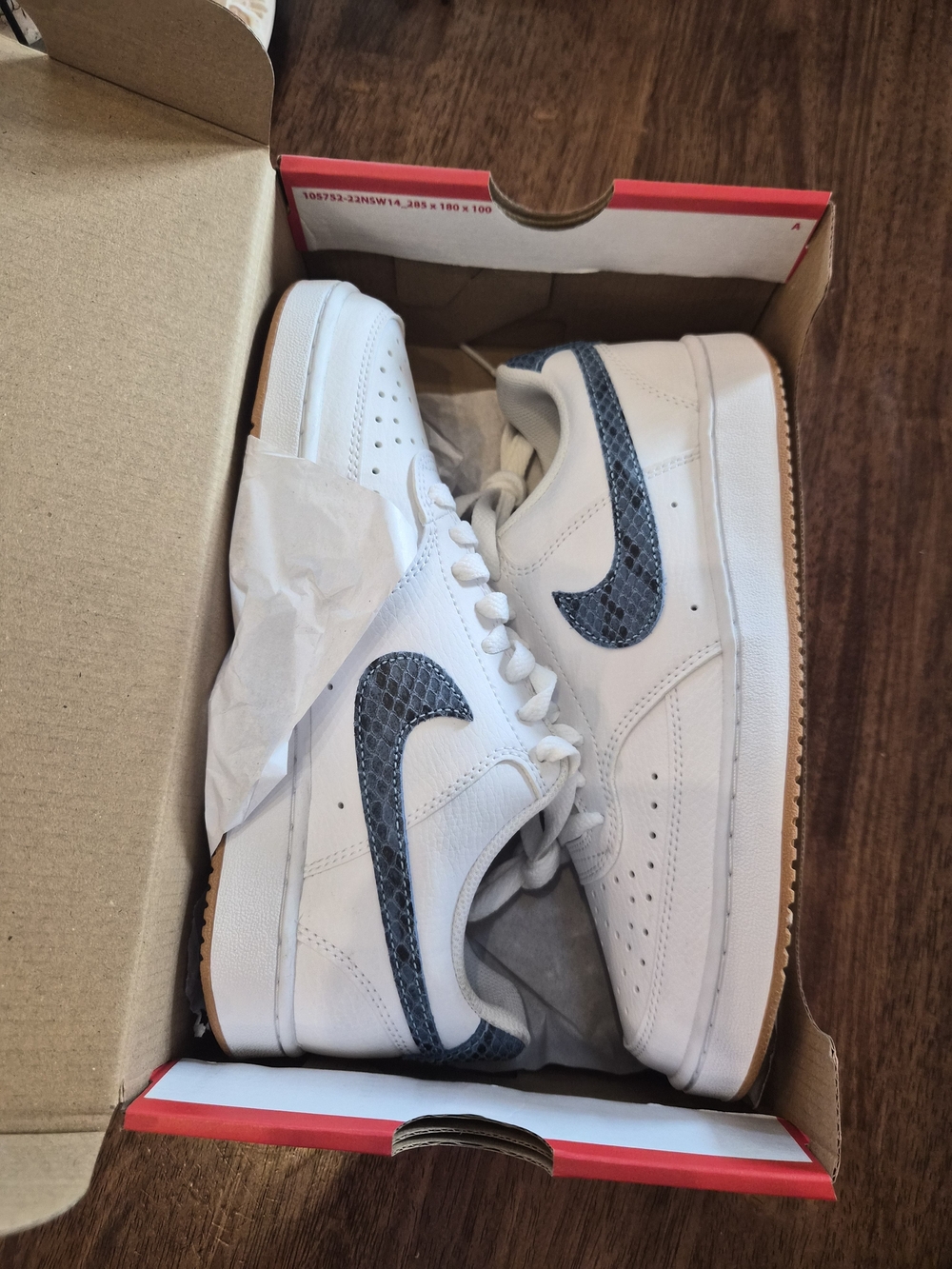 Nike White Low-Top Sneakers with Navy Snake Swoosh